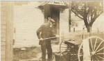 Luther Healy, at 983 Cilley Road. He was a tin smith and a carpenter. Shown working at his wagon. Manchester NH
